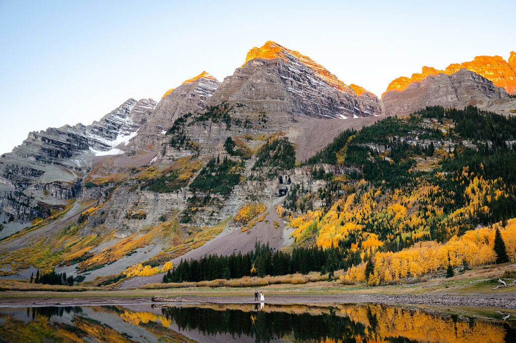 A couple elopes in the fall in the mountains of Colorado. 